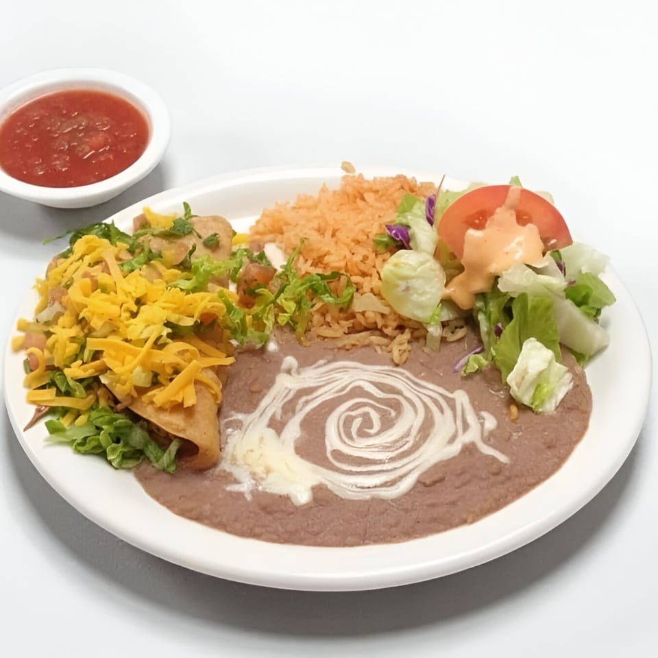 Mexican combination plate with taquitos, rice, refried beans, salad, and a side of salsa.